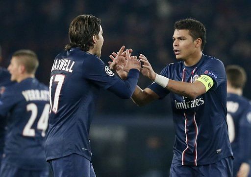 Paris Saint-Germain's Thiago Silva (R) and Maxwell are pictured during their match against Barcelona on April 2, 2013